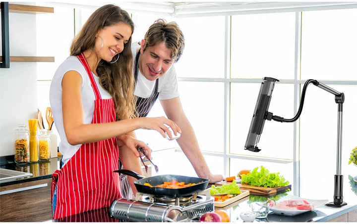 Versatile tech gadget: universal phone & tablet mount with an adjustable clip for multiple surfaces.