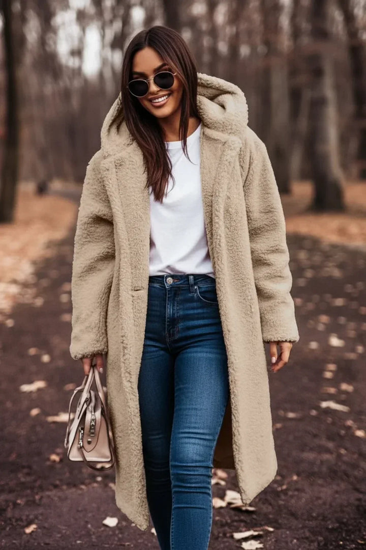 Warm women's oversized beige hooded winter coat, plush comfort, stylish button front. Perfect cozy fall outerwear.