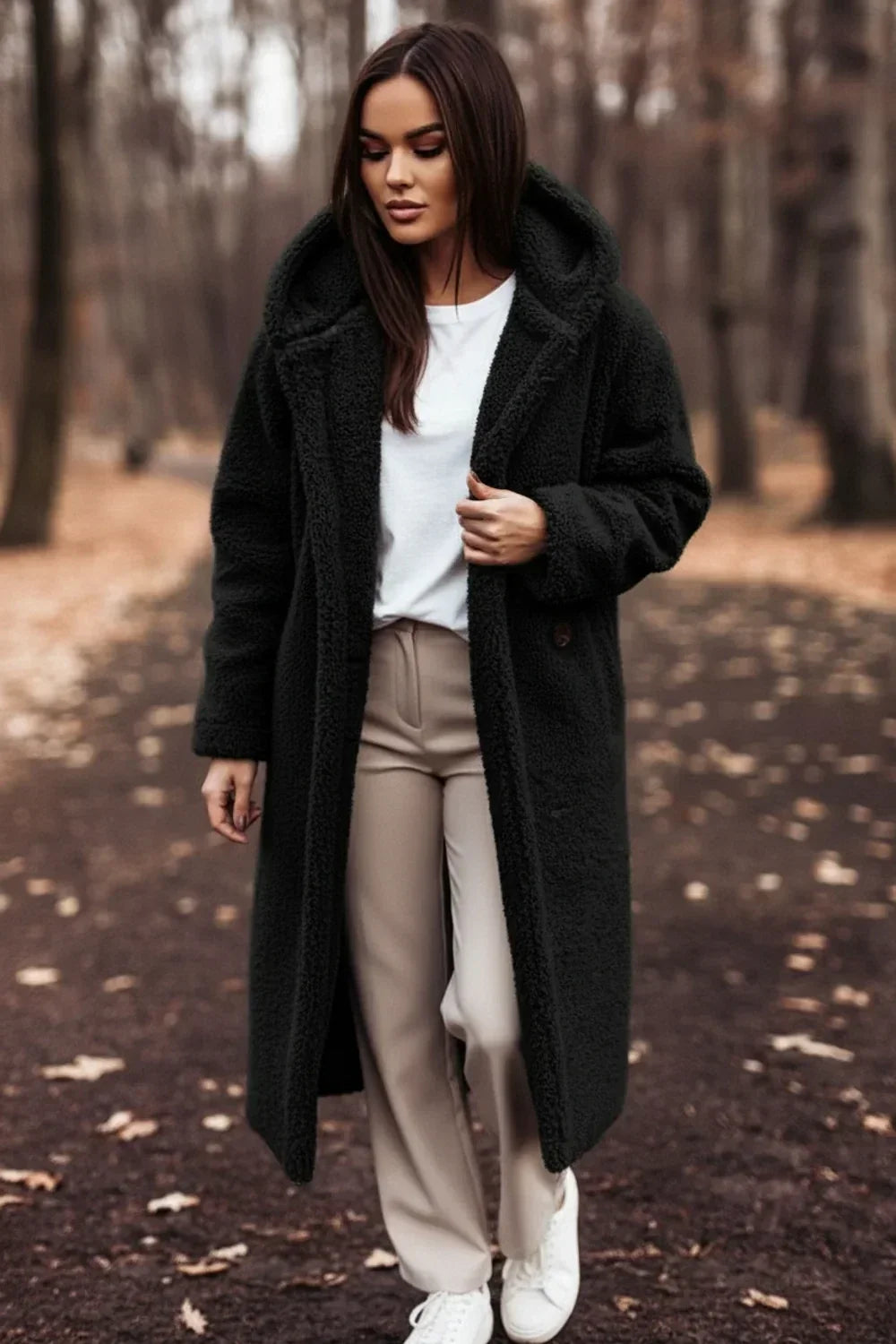 Stylish women's oversized green hooded winter coat with plush comfort. Features button front & long sleeves.