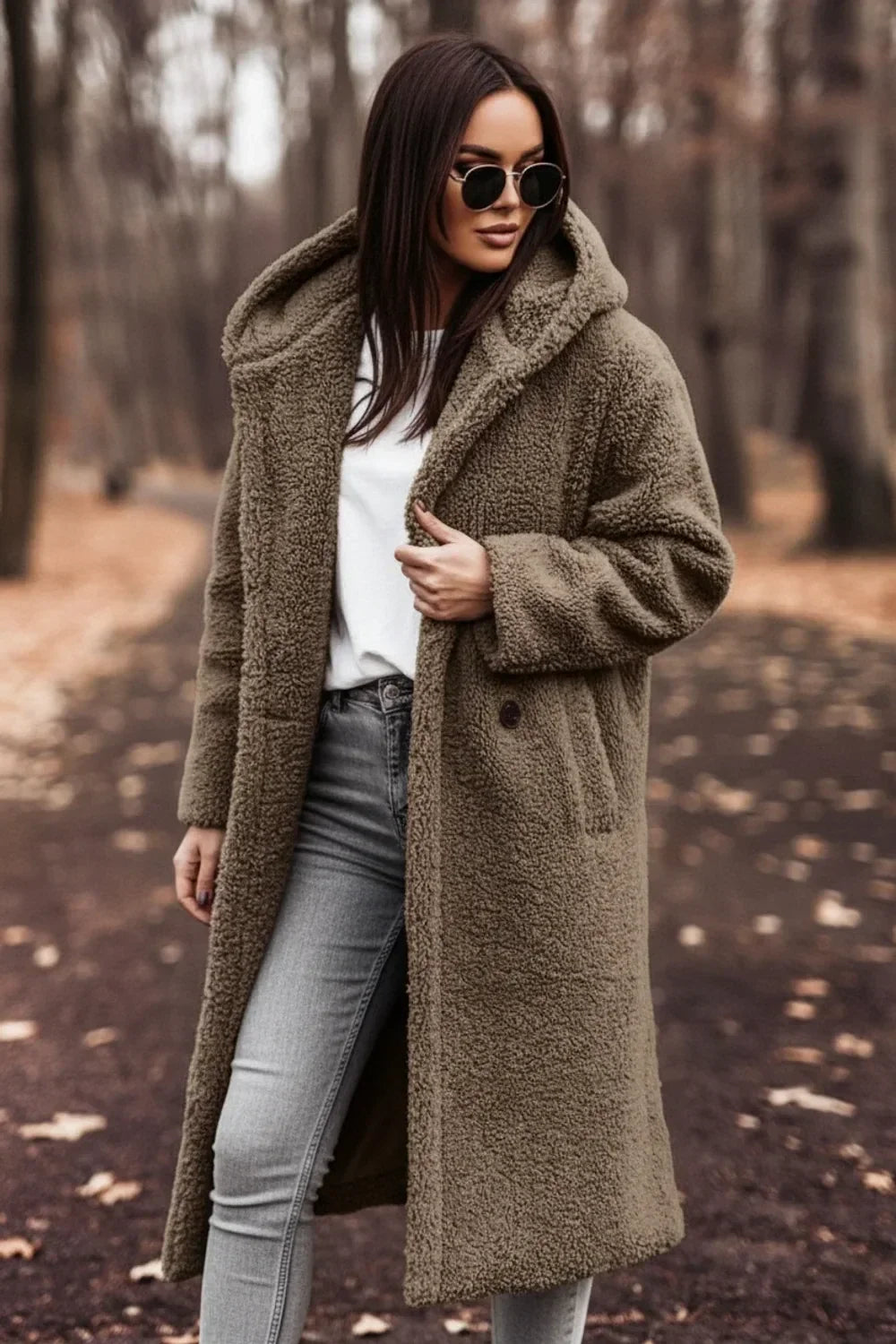 Back view of a women's oversized hooded winter coat, showcasing the cozy hood and long-sleeve design. Warm outerwear.