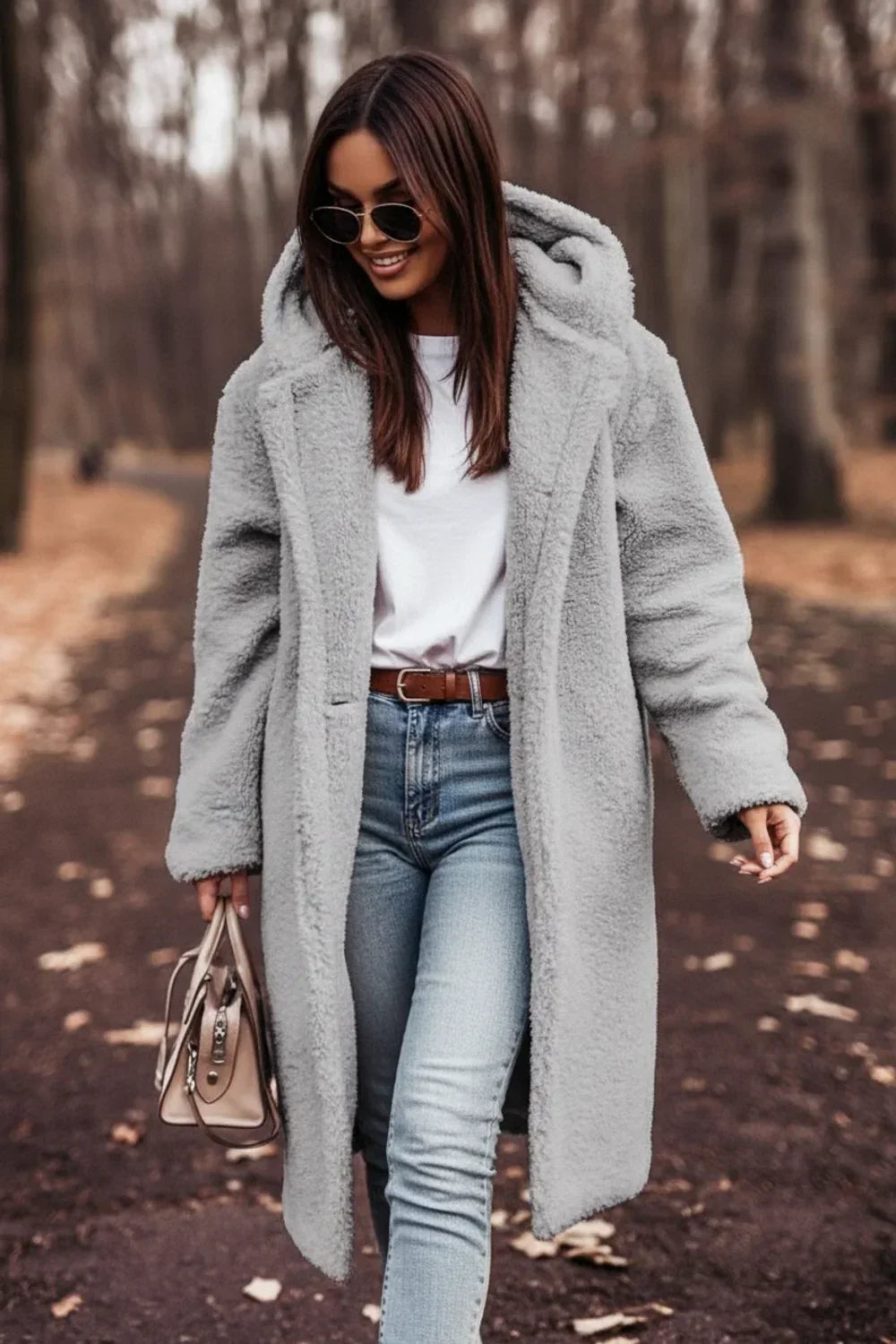 Women's warm oversized black hooded winter coat, featuring stylish button closure. Cozy long-sleeve fall outerwear.