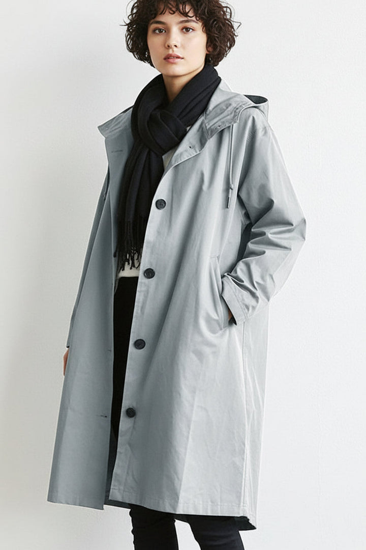 Women's lightweight hooded waterproof rain trench coat, ideal for spring & fall travel.