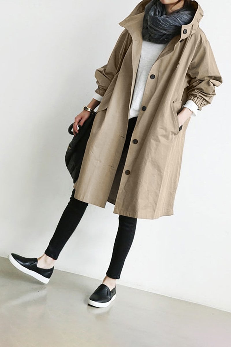 Elegant women's hooded waterproof trench coat, lightweight and breathable, perfect for all season travel.