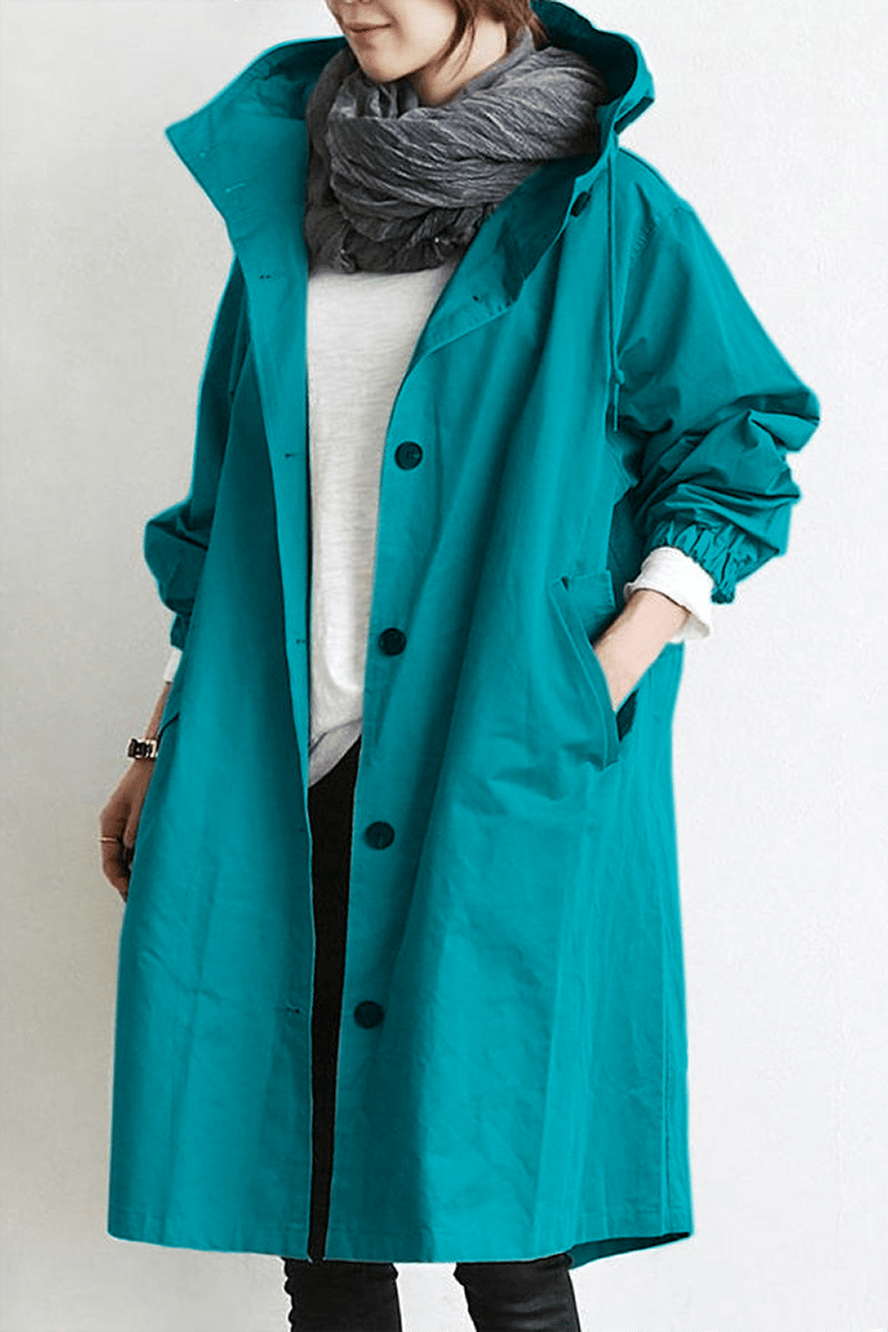 Fully waterproof women's hooded rain trench coat, lightweight & perfect for staying dry in spring & fall style.