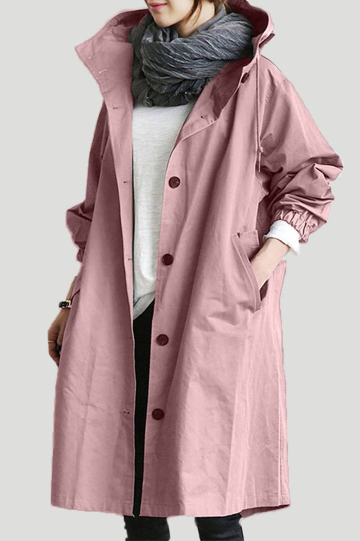 Essential women's lightweight hooded waterproof raincoat, perfect for chilly spring and autumn travel.