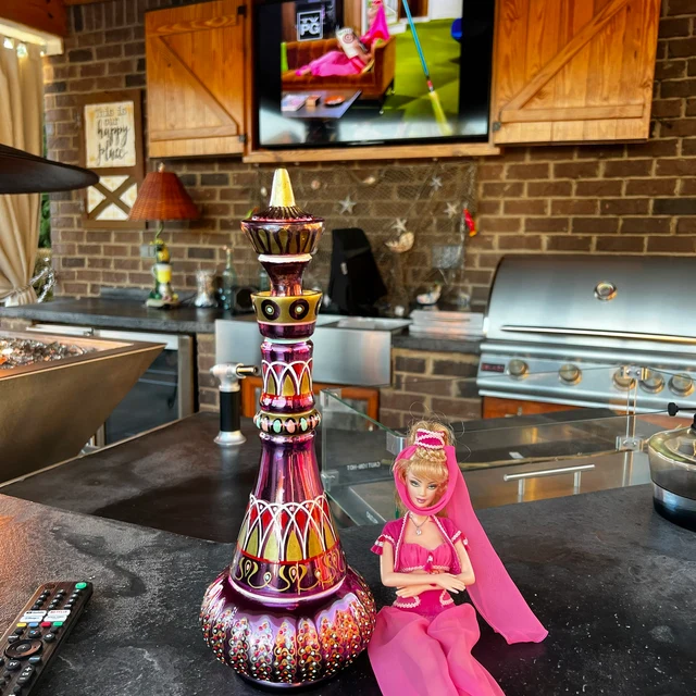 Vibrant purple hand-painted genie bottle, unique fantasy decor collectible.