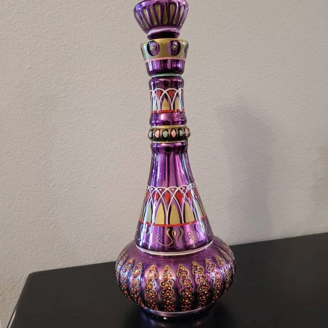 Striking purple genie bottle, hand-painted glass art, a beautiful fantasy collectible.