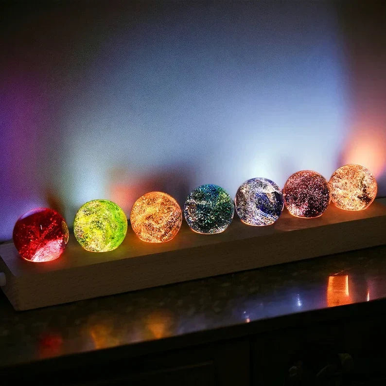 Elegant crystal galaxy orb on a beautiful wooden LED base, a stunning piece of celestial home decor.