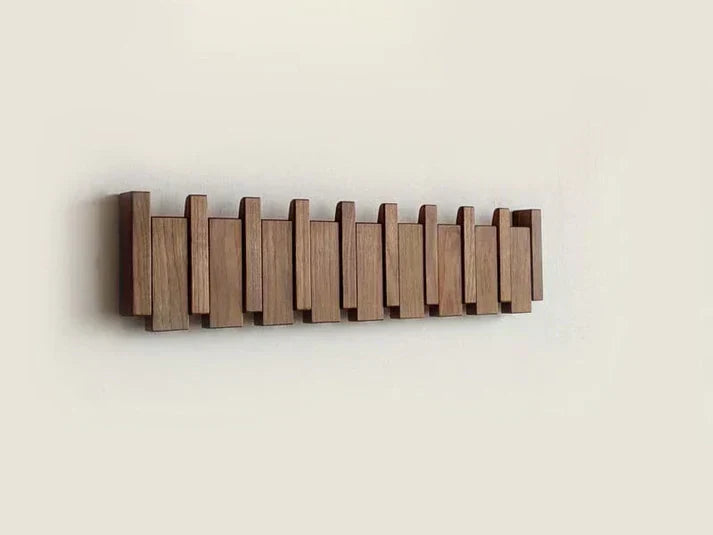 Home decor wall-mounted piano-style coat rack. Decorative wood hook organizer, a modern and artistic storage.