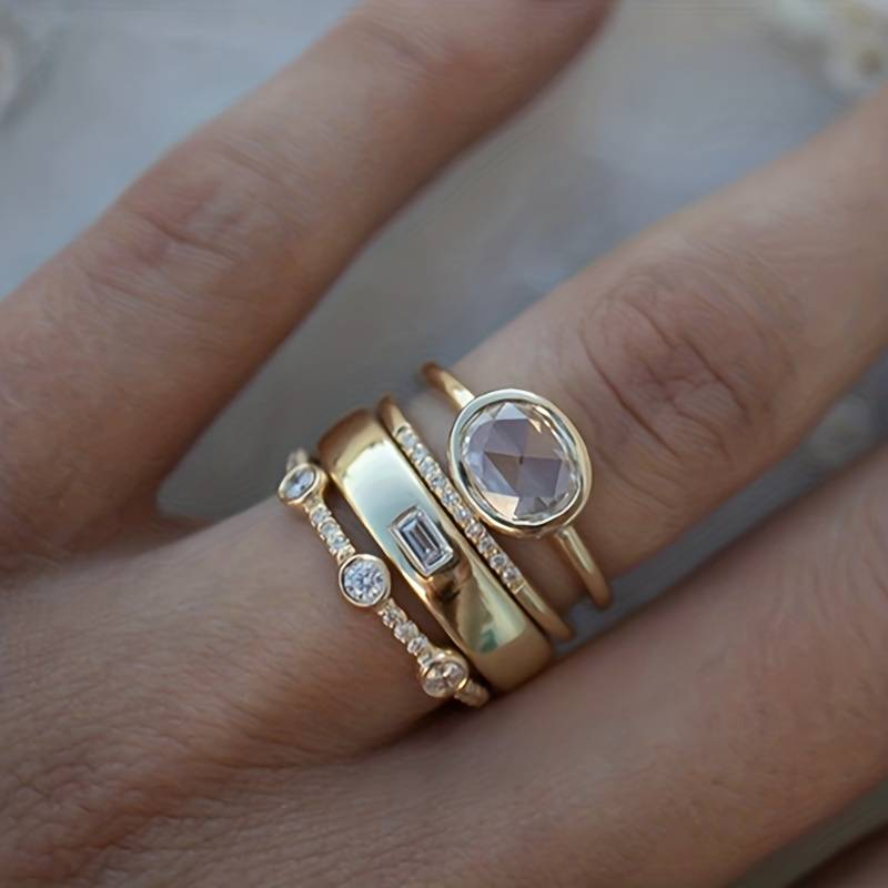 Women's vintage gold stackable ring set with sparkling zirconia. Elegant fashion jewelry, perfect gift.