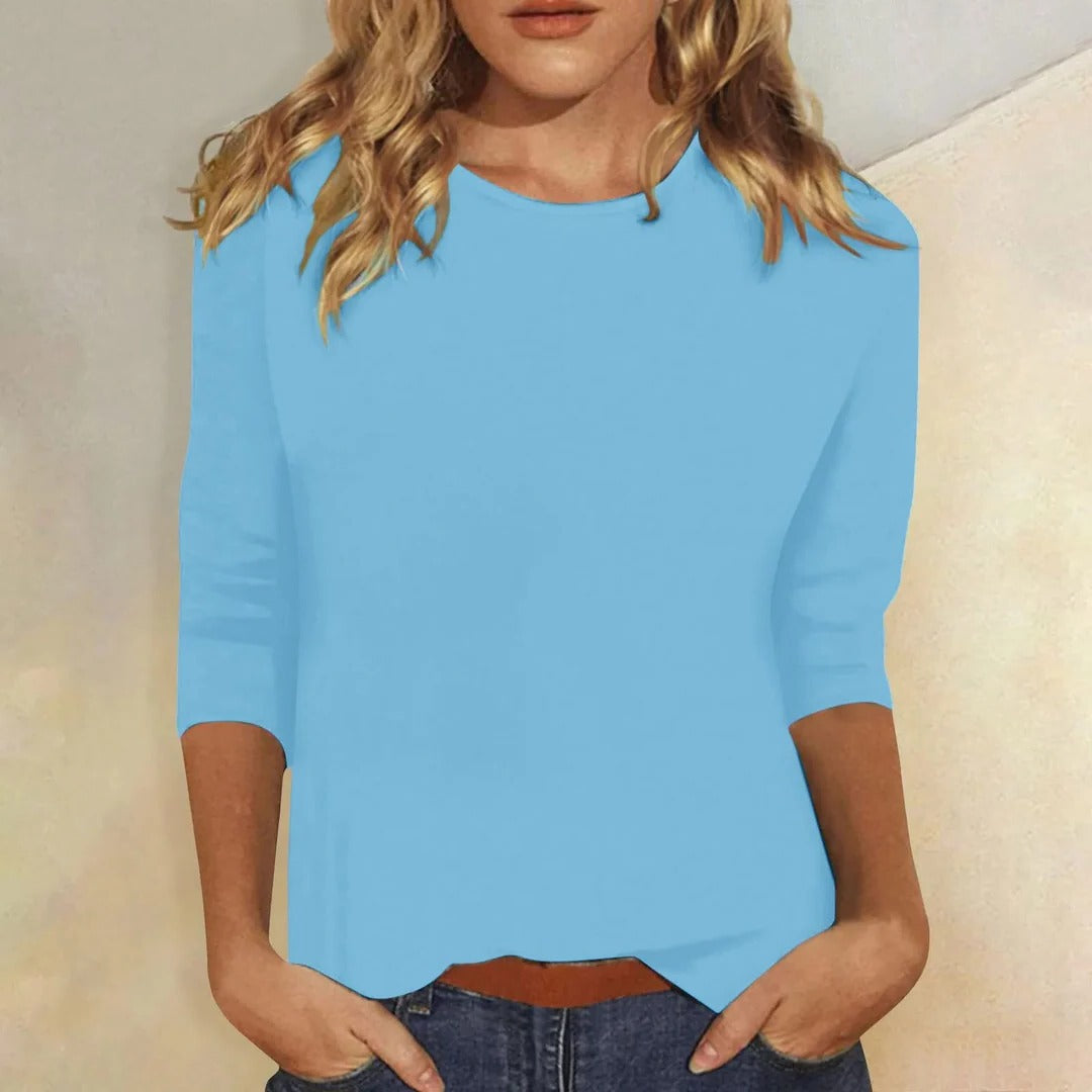 Versatile women's round neck 3/4 sleeve top, ideal for layering or simple everyday style.