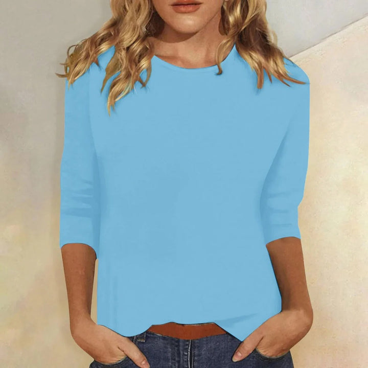 Versatile women's round neck 3/4 sleeve top, ideal for layering or simple everyday style.