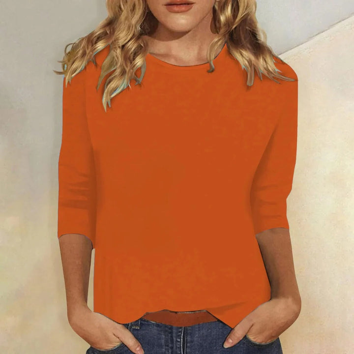Women's versatile round neck 3/4 sleeve top, excellent for layering or standalone casual wear.