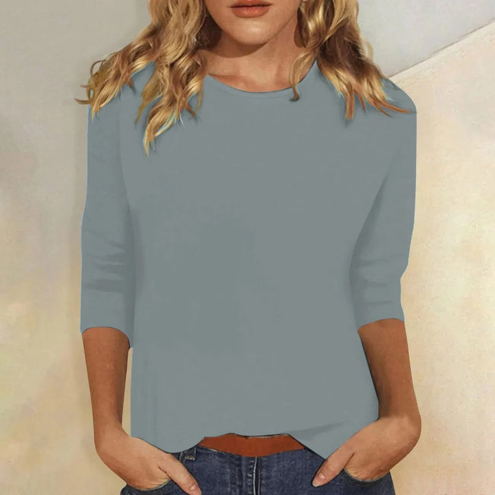 Plain women's round neck 3/4 sleeve top, a comfortable wardrobe essential for casual wear.