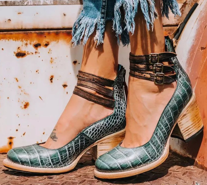 Women's strappy ankle boots: orthopedic comfort, fashion-forward design, block heel, and buckle accents.