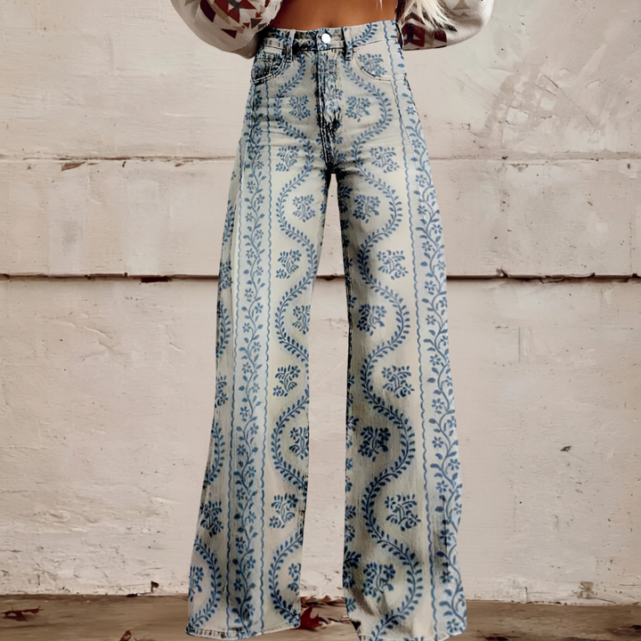 Statement women's high waist wide leg jeans featuring a striking floral print. Unique fashion jeans.