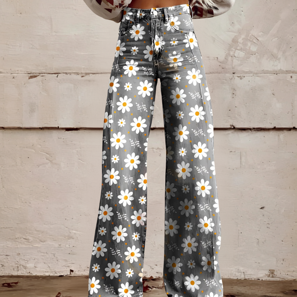 Women's high waist wide leg jeans with vibrant floral print. Stylish patterned denim for unique casual wear.