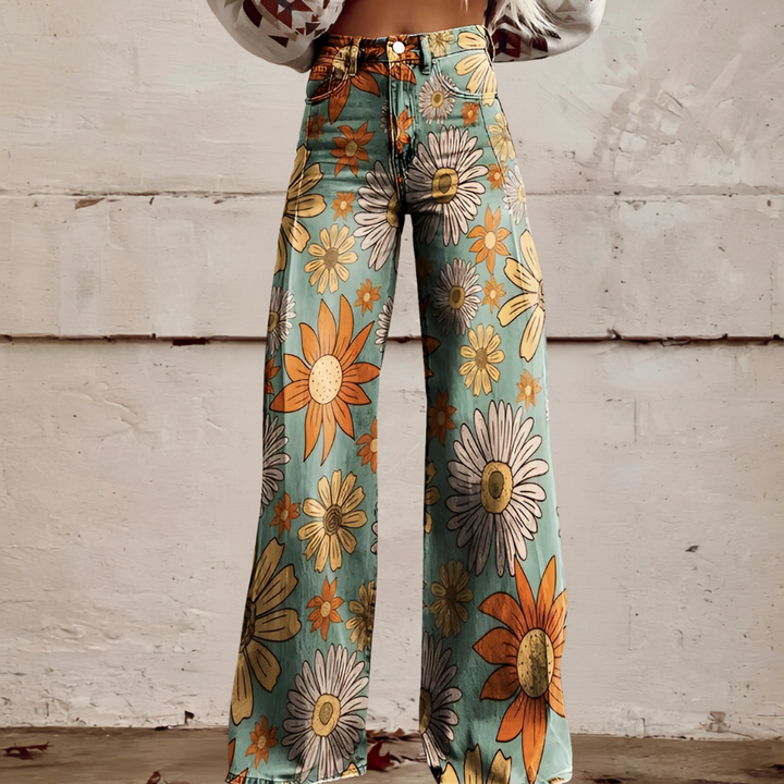 Side view of women's high waist wide leg floral jeans. Unique, comfortable, and stylish casual wear.