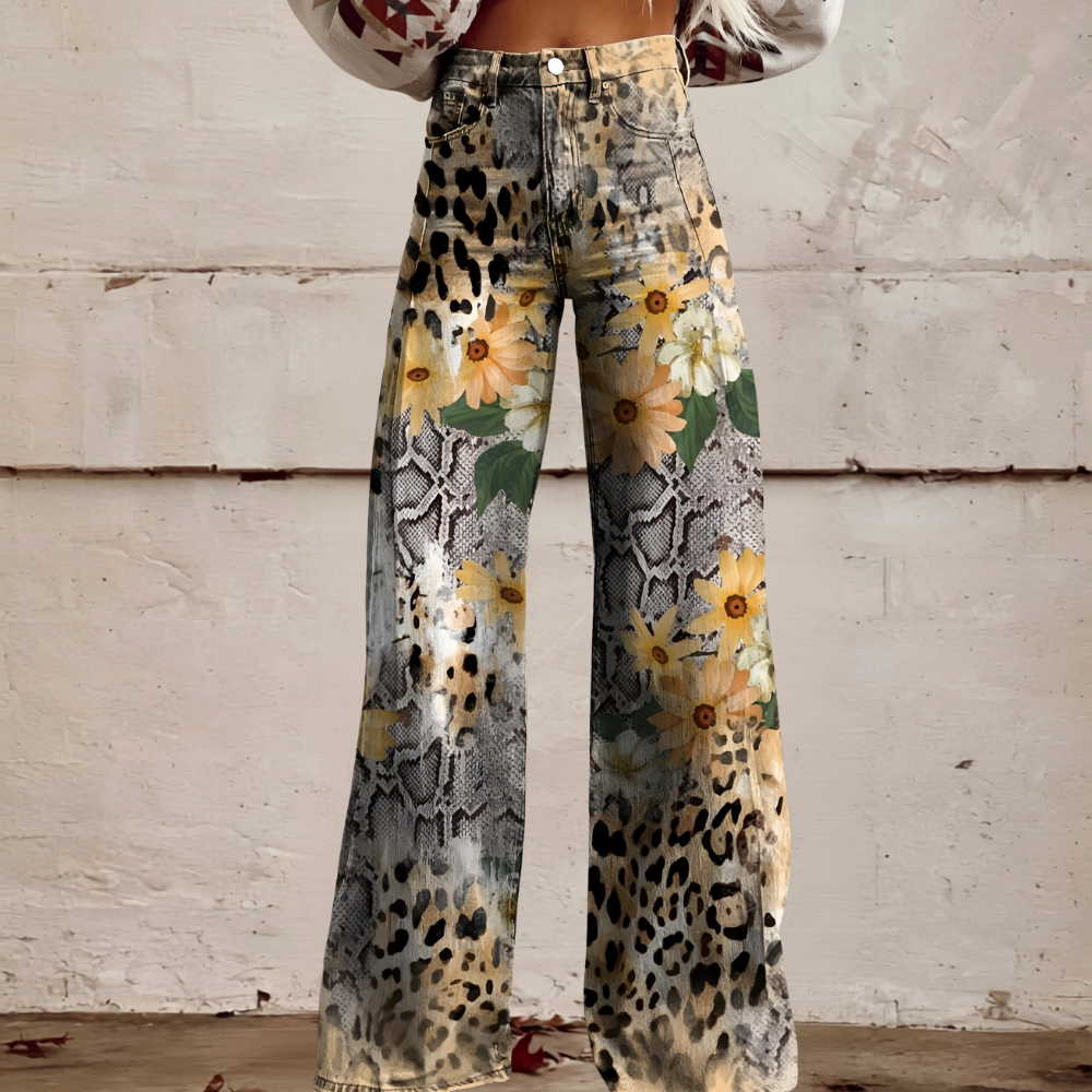 Back view of women's high waist wide leg floral jeans. Stylish casual wear with unique floral print.
