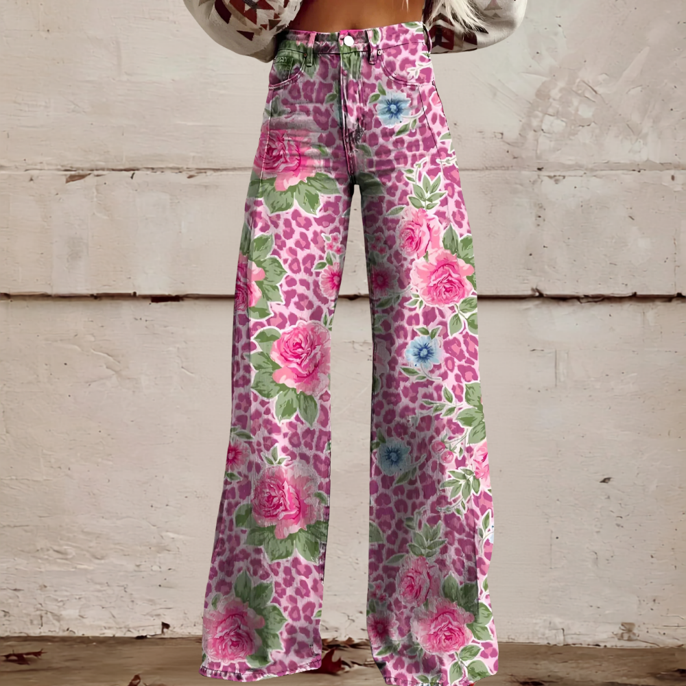 Close-up of women's floral print high waist wide leg jeans. Detailed patterned denim fabric for unique style.
