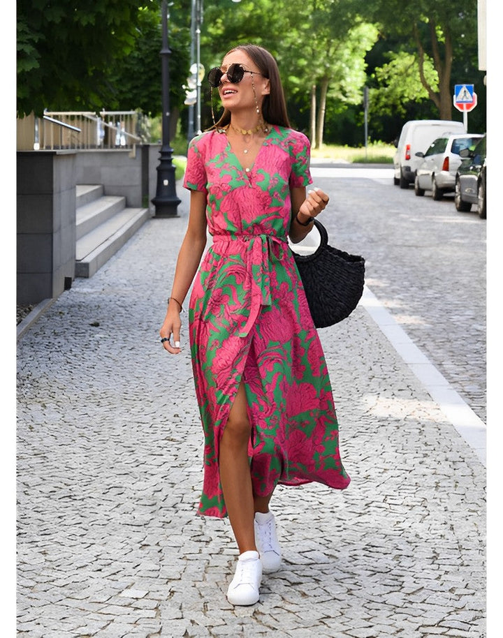 Elegant women's floral print maxi dress with a flattering belt, perfect for summer parties or evening events.