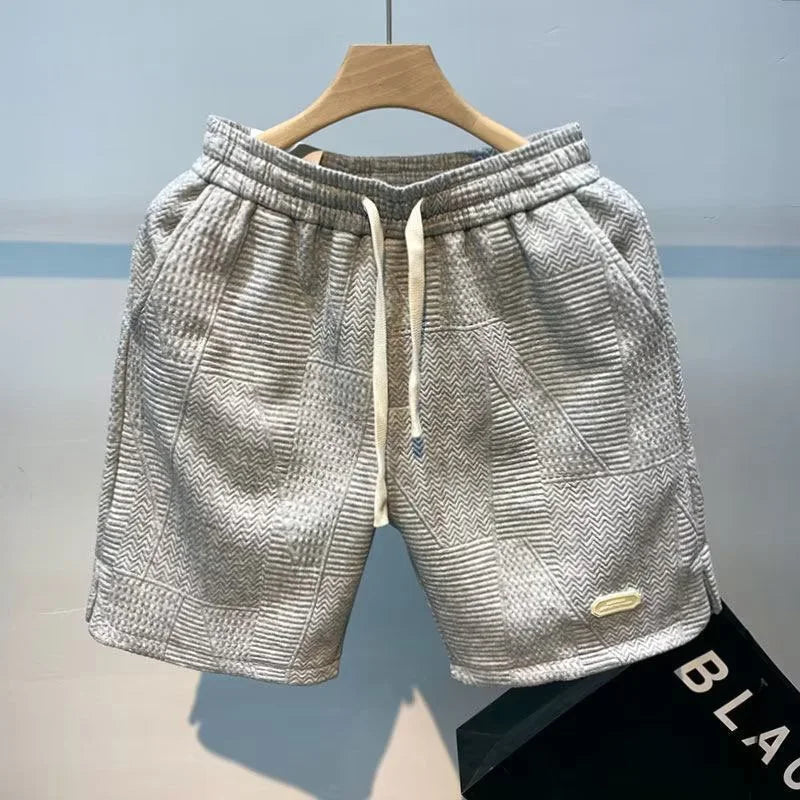 Mid-rise, regular fit men's casual herringbone shorts, offering cool summer comfort.