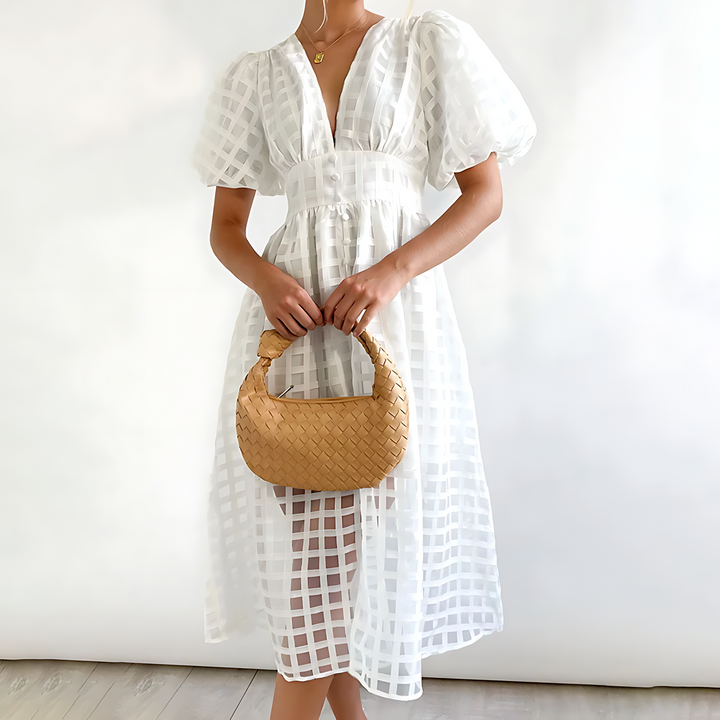 Sophisticated women's summer midi dress, featuring a unique square pattern and fashionable puff sleeves.