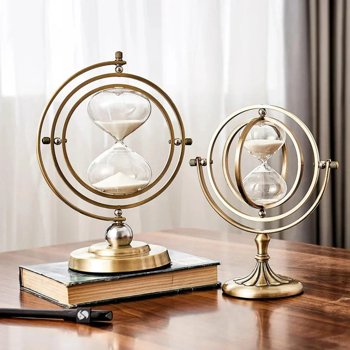 Elegant metal frame hourglass sand timer for modern home or office tabletop decor.