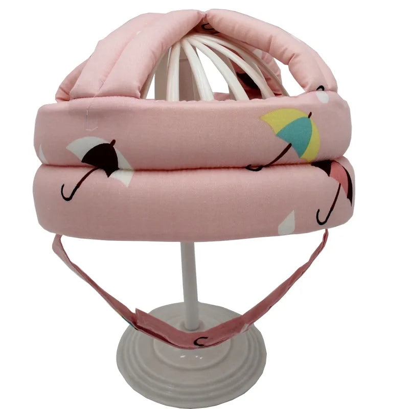 Baby crawling helmet, soft and protective, adjustable for a secure fit on infants.