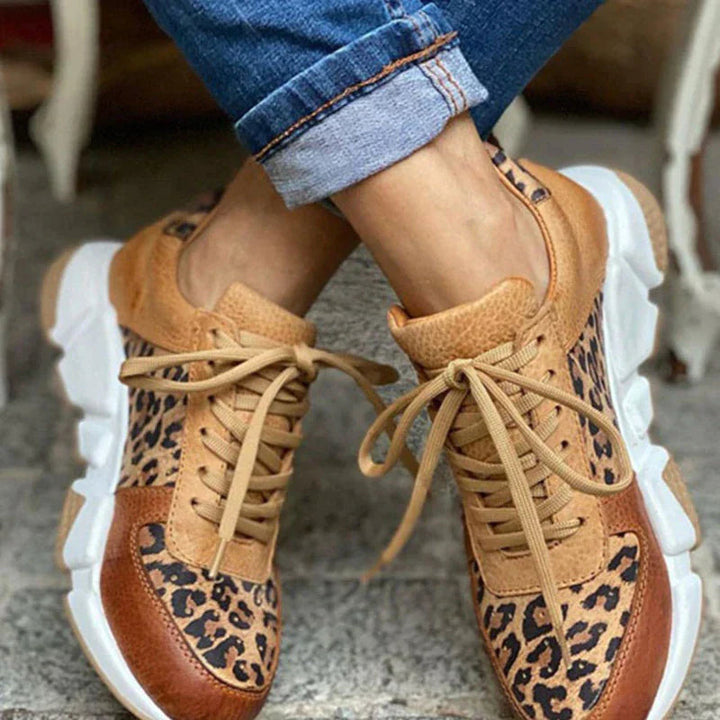 Women's stylish leopard print fashion sneakers with white sole, perfect for trendy casual wear.