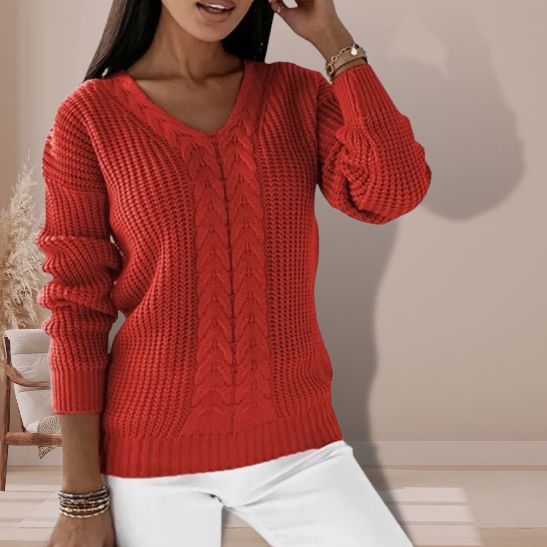 Close-up of a women's V-neck long sleeve knit sweater, showcasing its soft texture and elegant design.