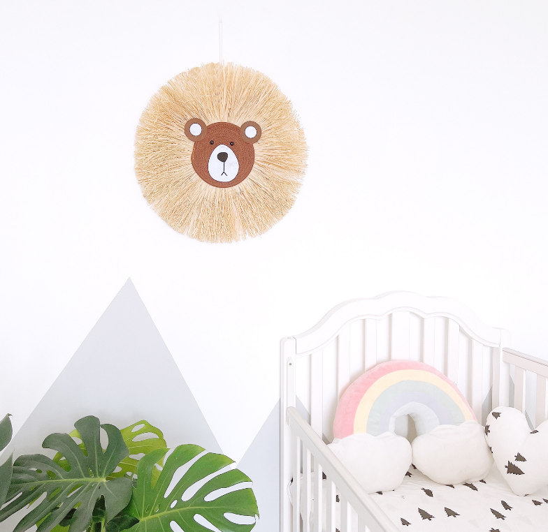 Baby bedroom art: soft rattan lion wall hanging. Handmade nursery decor, perfect for kids.