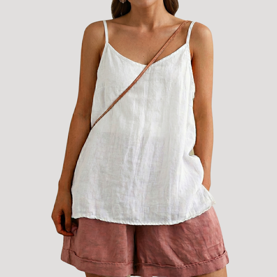 Chic women's flowy cami top with V-neck & spaghetti straps. Ideal sleeveless summer apparel for any casual occasion.