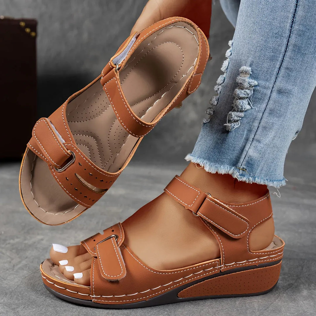Stylish women's orthopedic strap sandals showcasing elegant design, comfortable footbed & arch support.