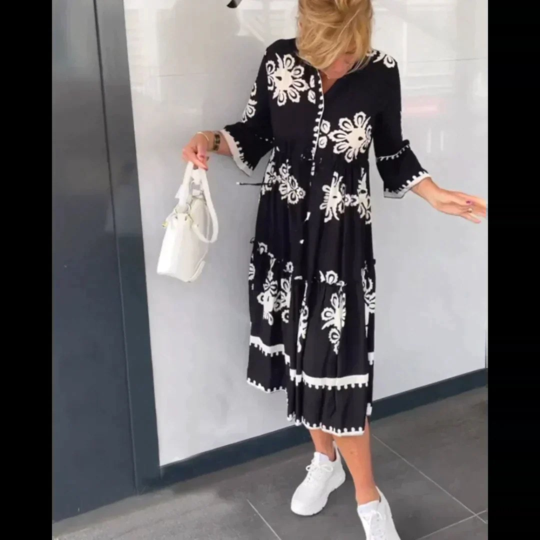 Elegant women's midi dress with vibrant floral print, ideal for summer parties and casual wear.