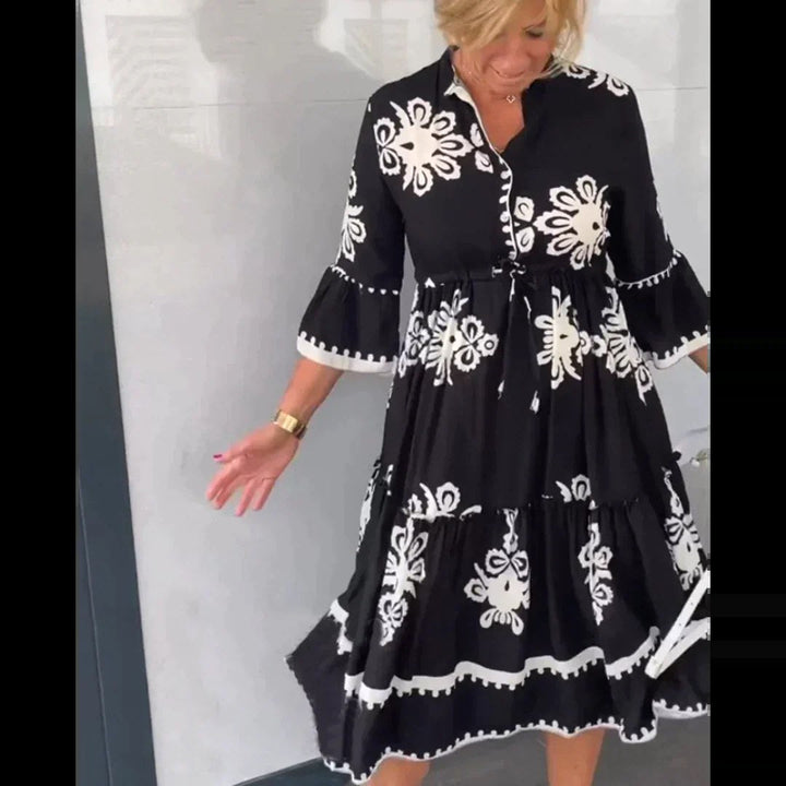 Flowy floral print summer midi dress for women, offering an elegant and comfortable casual style.