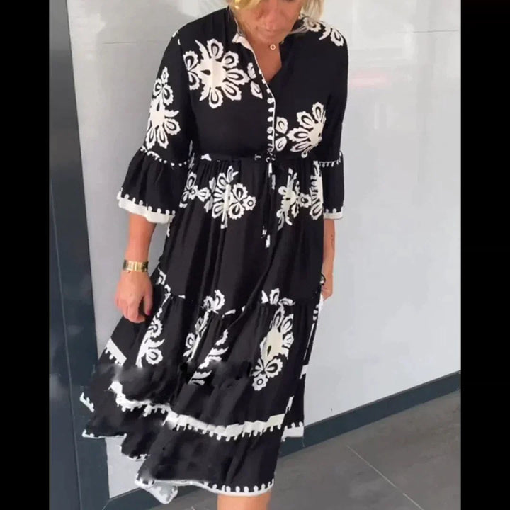 Chic women's printed midi dress featuring a delicate floral pattern, perfect for elegant summer events.