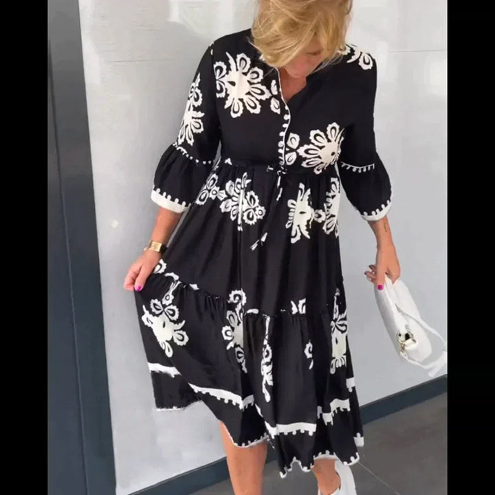 Vacation-ready women's floral midi dress; a stylish and elegant summer dress for resorts or daily wear.