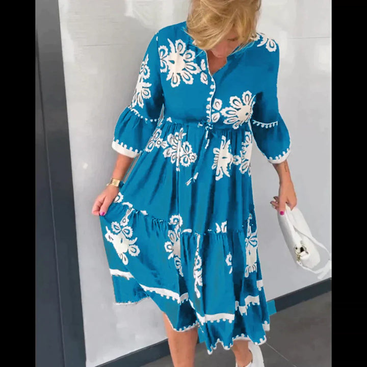 Casual yet elegant women's summer midi dress with a charming floral print, suitable for various occasions.