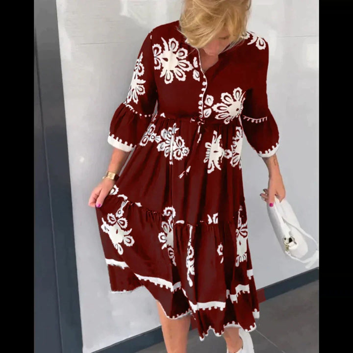 Women's elegant midi length floral dress in a vibrant print, designed for comfortable summer style.
