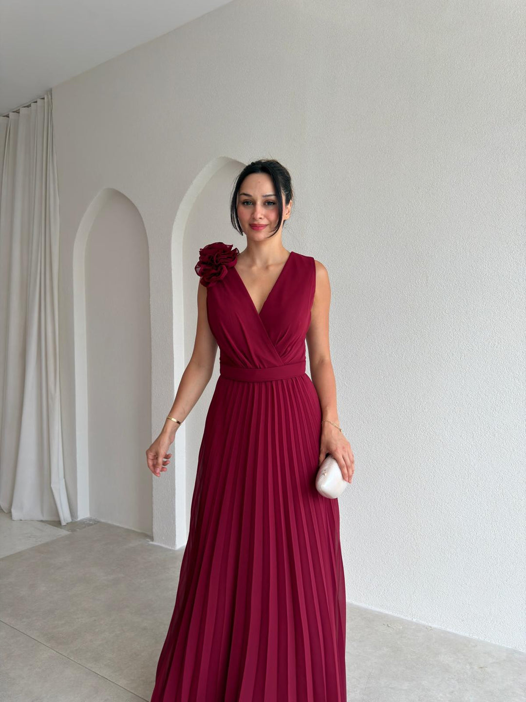 Formal women's evening gown: empire waist, pleated, floral appliqué. A chic v-neck dress for wedding guests.