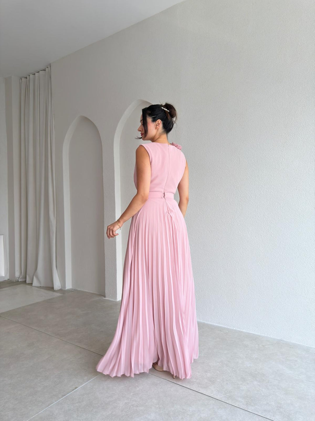 Elegant women's A-line cocktail dress with graceful pleats, v-neck, and delicate floral appliqué. Perfect for guests.