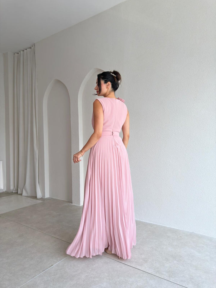Elegant women's A-line cocktail dress with graceful pleats, v-neck, and delicate floral appliqué. Perfect for guests.