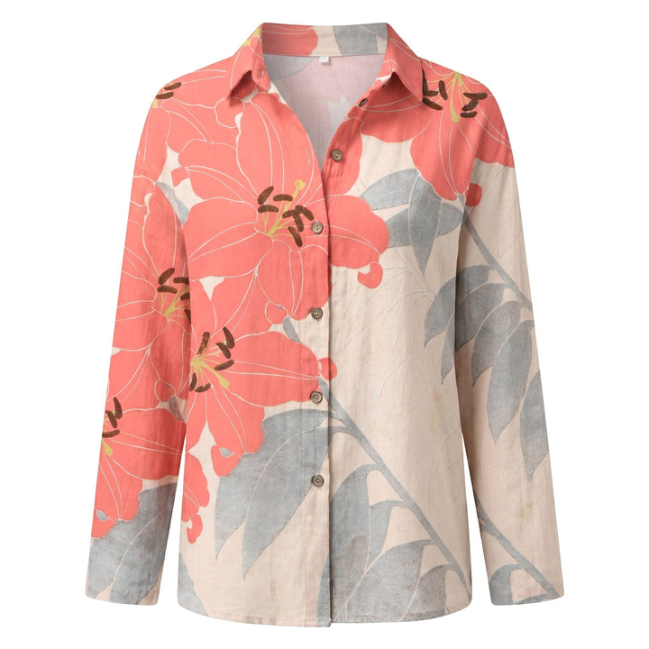 Relaxed fit women's top with abstract print, V-neck, and roll-up sleeves. Ideal for spring fashion.