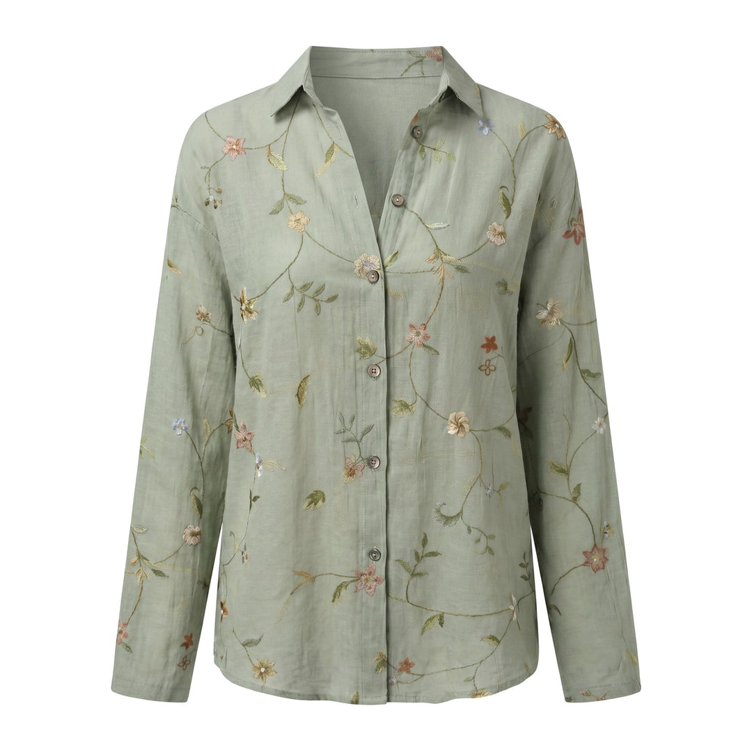 Casual women's blouse with vibrant abstract print, V-neck, adjustable roll-up sleeves. Everyday.