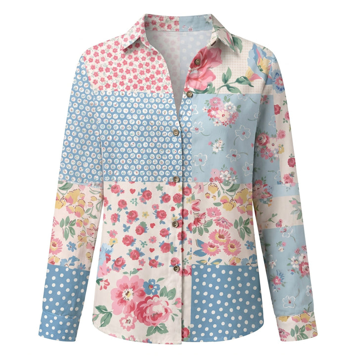 Women's spring/summer blouse featuring abstract print, V-neck, and versatile roll-up sleeves.