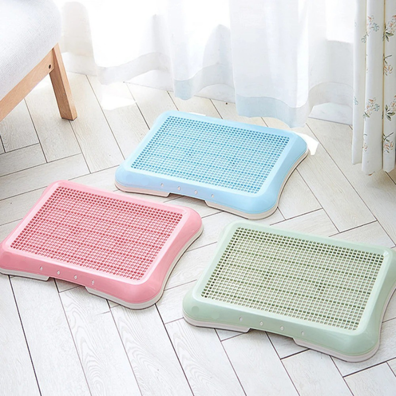 Indoor pet potty with realistic artificial grass & easy clean tray. Essential for puppy house training.