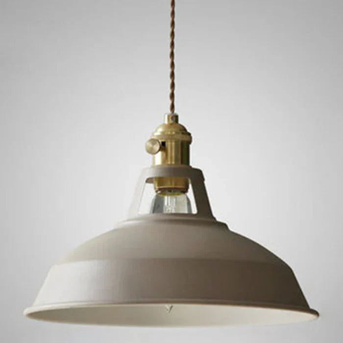Close-up of the vintage metal pendant light, showcasing industrial design.