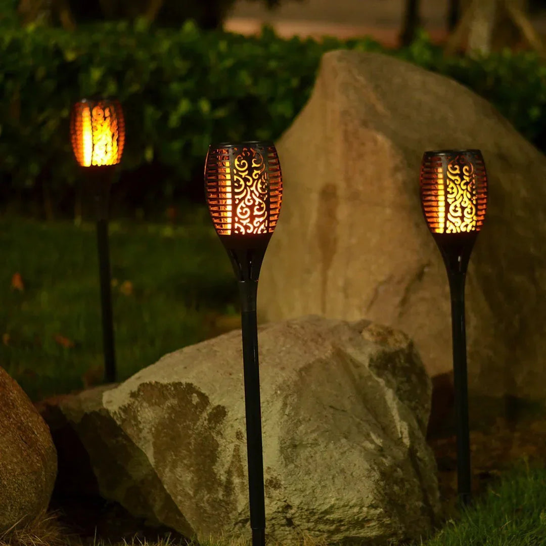 Yard solar torch light, offering a beautiful, safe flickering LED flame for outdoor garden decoration.