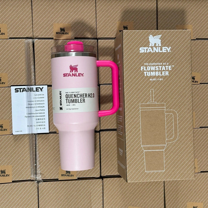 Unisex 40oz insulated travel mug with sturdy handle & reusable straw. Perfect for hot or cold drinks.